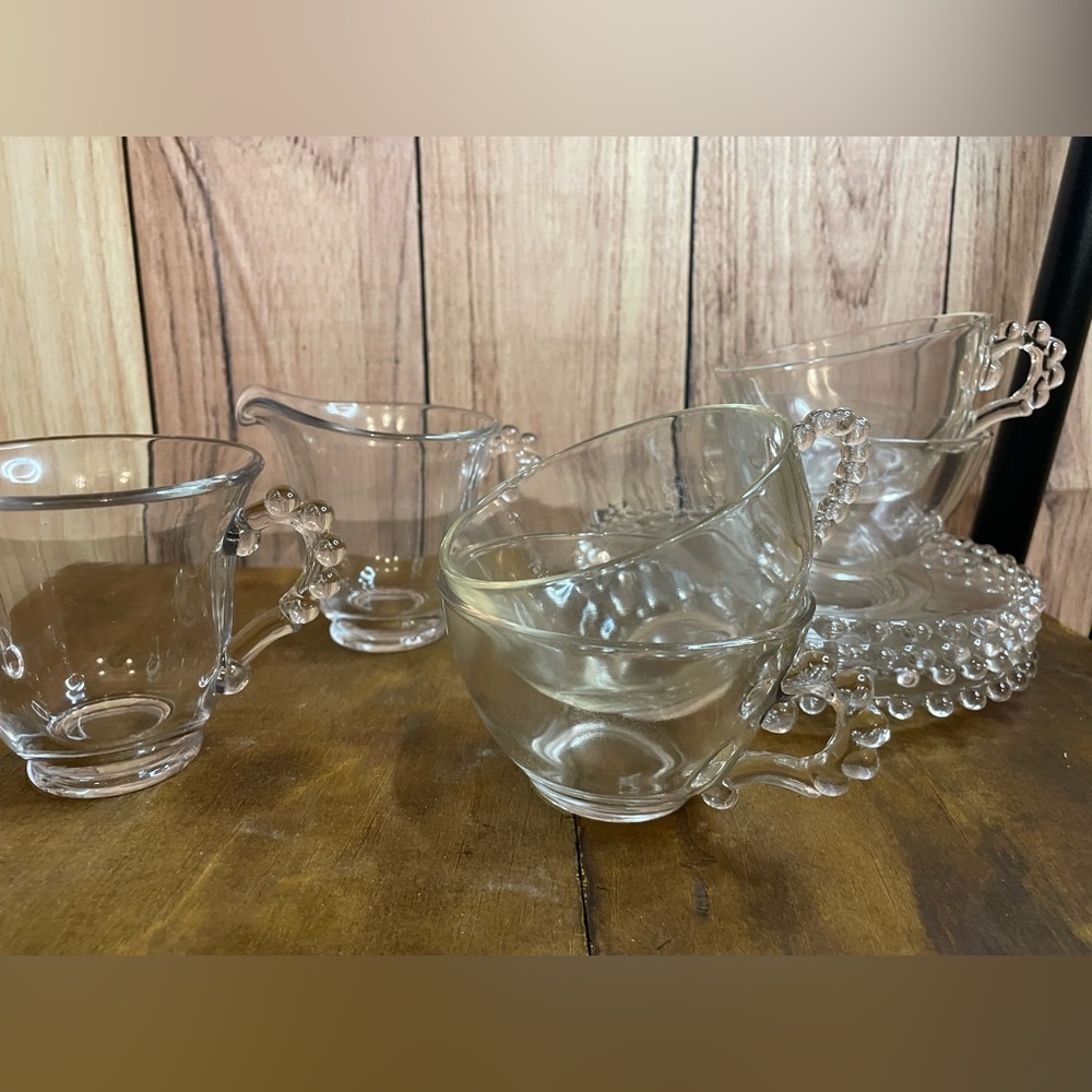 Unique Vintage Clear Glass Teacup and Saucer Set of 4 with cream and sugar.